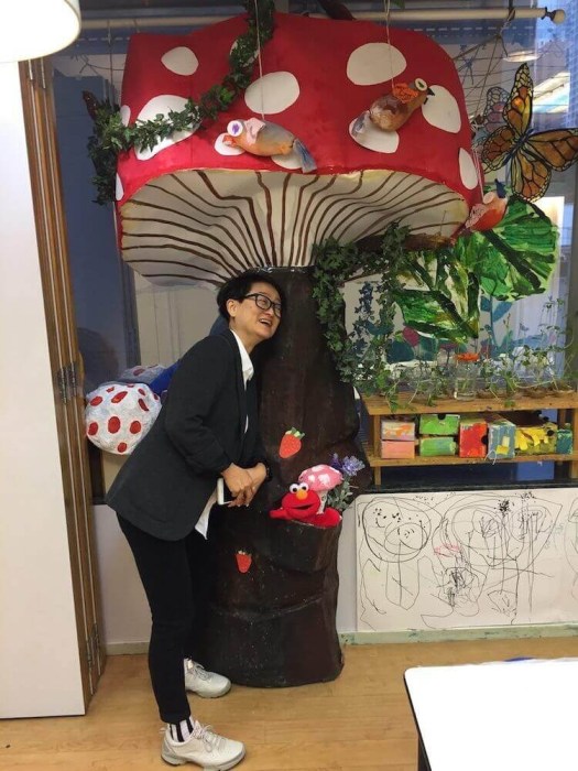 Auntie Angie beneath the giant toadstool.